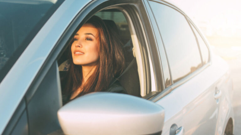 A Woman Enjoying A Newly Purchased Car